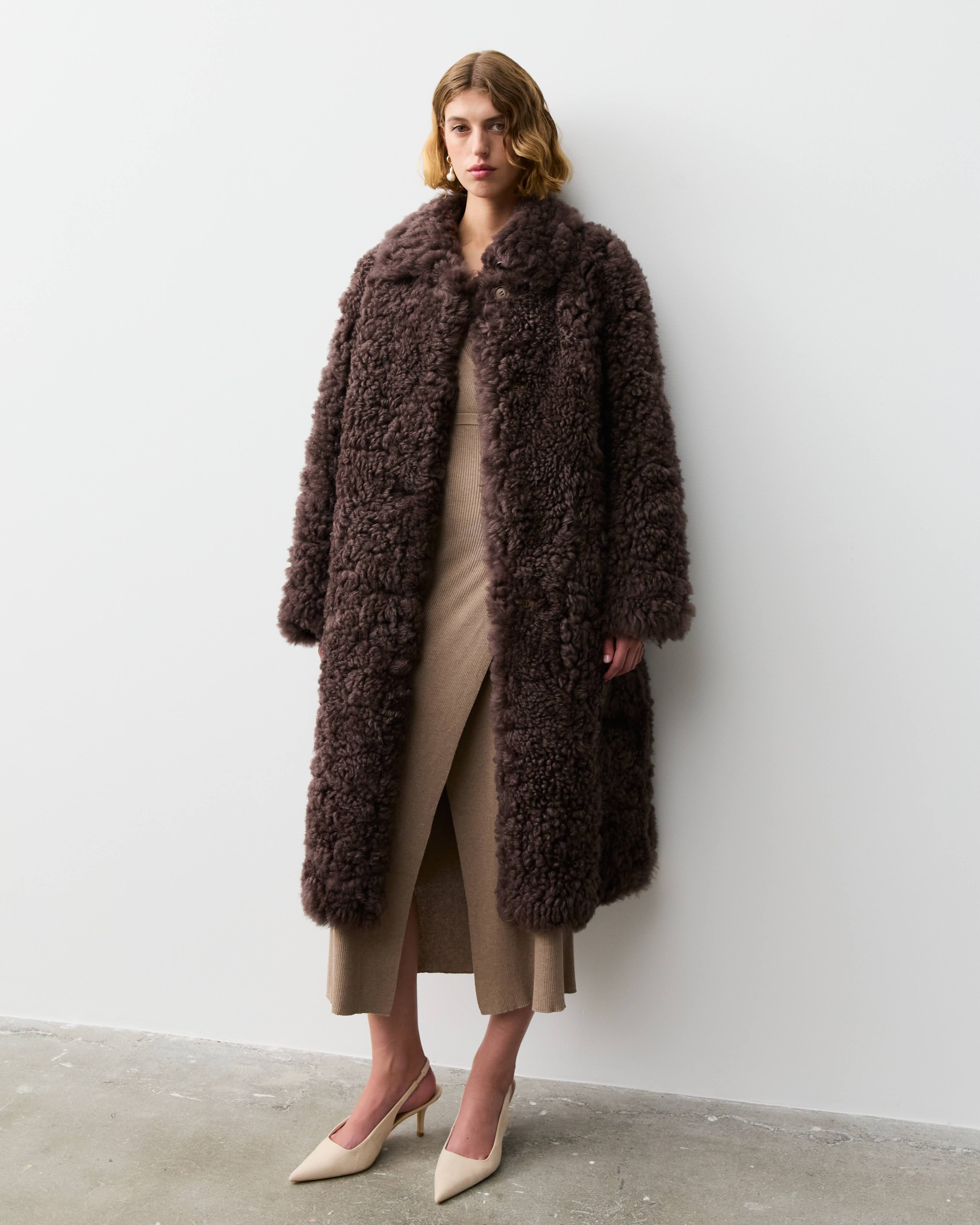 THE LONG SHEARLING COAT- CHOCOLATE – THE CURATED